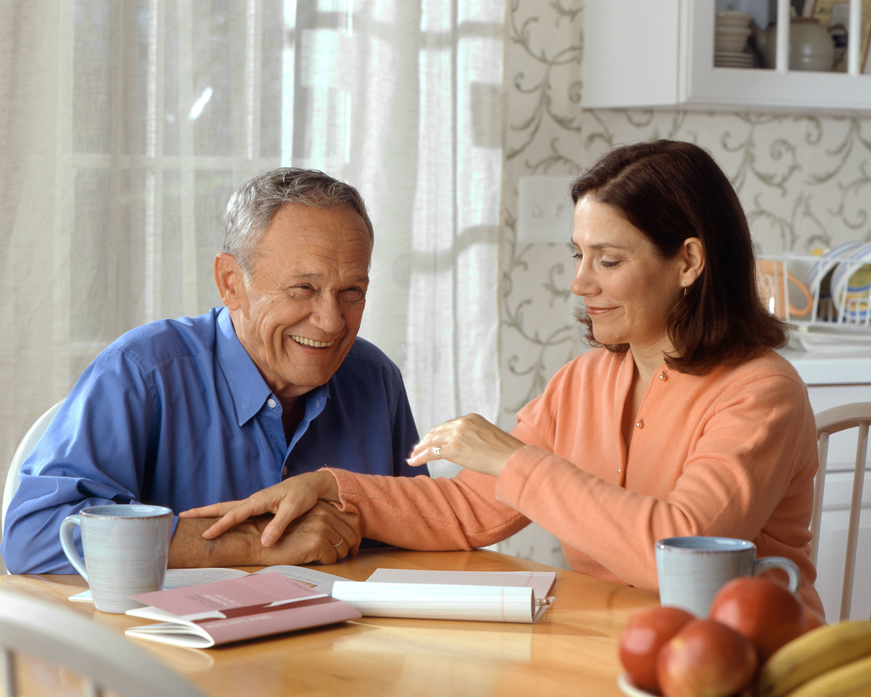 elderly man and woman at the table